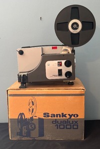 lot 323 image: Sankyo Dualux 1000 Motion Picture Projector with Reel and Original Box