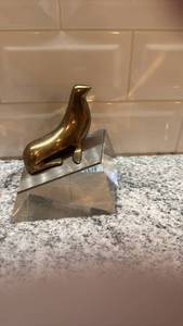 lot 16 image: Loet Vanderveen Bronze Seal Figure on Lucite Base 4.5 x 4.5 in