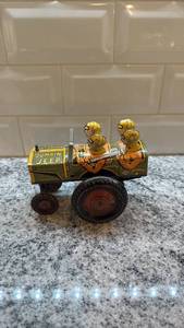 lot 38 image: Vintage Jumpin Jeep Tin Wind-Up Toy with Two Figures