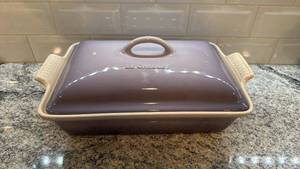 lot 41 image: Le Creuset 9x13 Stoneware Covered Baking Dish, Purple