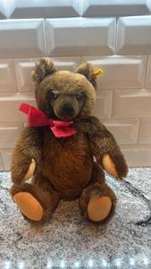 lot 82 image: Steiff Plush Teddy Bear with Red Bow and Tags, 15 Inch