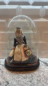 lot 100 image: Antique European Doll in Traditional Costume Under Glass Dome