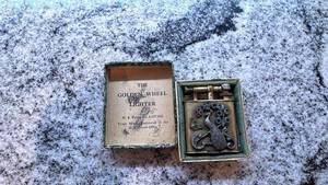 lot 127 image: Vintage Golden Wheel Lighter with Peacock Design and Original Box