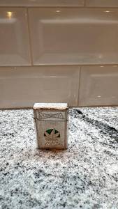 lot 129 image: Vintage Metal Cigarette Lighter with Marijuana Logo