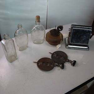 lot 56 image: Vintage Lot of Glass Bottles, Old Time Toaster and Cast Iron Flue baffles