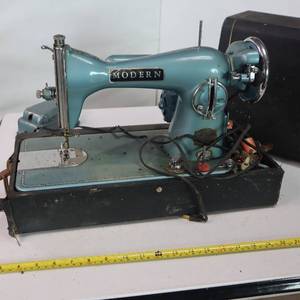 lot 110 image: Vintage Modern sewing machine with case