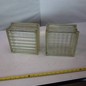 lot 143 image: Two standard glass blocks