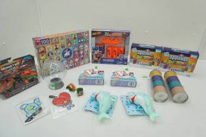 lot 79 image: Monster Jam Trucks, Nerf, Puzzle, Elmers Squishies, Pencil Cases, Globe Bank