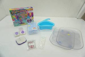 lot 106 image: Rhinestone Canister Keychains, Fashion Fidgets Set, Rotating Trays, Strainer and more