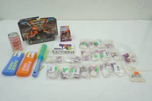 lot 112 image: Model Toy Gun, Secret Storage, Monster Jam Trucks, Charms