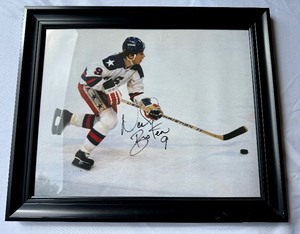 lot 28 image: Neal Broten Signed and Framed Photo From 1980 Miracle on Ice Gold Medal Team USA Olympic Hockey