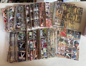 lot 143 image: Large Box of Unsorted Binder Sheets - Baseball and Football Cards