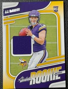 lot 52A image: JJ McCarthy RC Relic 2024 Absolute Rookie Materials #ARM-JMY Rookie Minnsota Vikings Football Card