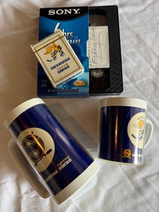 lot 154B image: Minnesota Fighting Saints Vintage Hockey Lot - 2 Cups  Mugs, New Playing Card Set, VHS Tape
