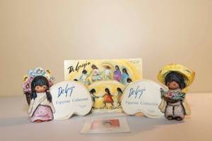 lot 38 image: DeGrazia Goebel The Children of DeGrazia Flower Girl and Flower Boy Collection Plaques and Postcard Book