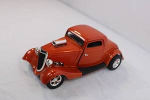 lot 2 image: Die-Cast Model 1930s Orange Coupe Car with Removable Hood and Opening Doors