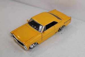 lot 12 image: 124 Scale 1967 Chevy Nova SS Diecast Model Car Yellow