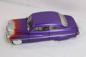 lot 26 image: Diecast 1949 Mercury Purple Custom Car Model with Flames