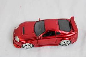 lot 40 image: Red Toyota Supra Diecast Model Car with Opening Doors