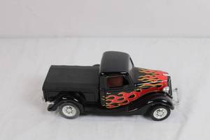 lot 47 image: UNMC Ford V8 Die-Cast Pickup Truck Model with Flame Graphics