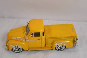 lot 51 image: DUB City Chevrolet Diecast Pickup Truck Model Yellow with Flames
