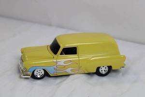 lot 62 image: Die-Cast Yellow Vintage Panel Car Model with Flame Graphics