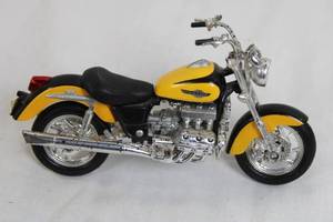 lot 94 image: Yellow and Black Diecast Motorcycle Model