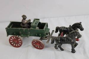 lot 106 image: Antique Cast Iron Horse Drawn Wagon Toy with Driver