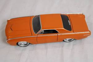lot 116 image: Jada Toys 1963 Thunderbird Diecast Car Model Orange