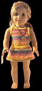 lot 62 image: American Girl 18-Inch Doll with Patterned Dress and Pendant Necklace
