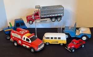 lot 96 image: Collection of 6 Diecast and Plastic Toy Vehicles by Tonka,  Ertl, Kinsmart and More