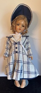 lot 146 image: Pretty Vintage Doll with Bonnet and Plaid Coat
