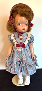 lot 155 image: Doll with Blue Floral Dress and Straw Hat