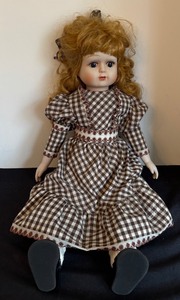 lot 161 image: Vintage Porcelain Doll with Checkered Dress and Curly Blonde Hair