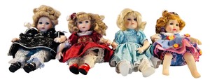 lot 72 image: Set of 4 Vintage 9-Inch Porcelain Dolls with Curly Hair and Dresses