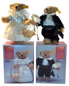 lot 74 image: Pair of 8.5-Inch Steiff Button in Ear Flower Bearer and Ring Bearer Teddy Bears