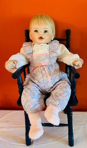 lot 453 image: Baby Doll in 23 Inch Rocking Chair