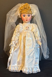 lot 34 image: Brides of America Porcelain Bride Doll with Veil