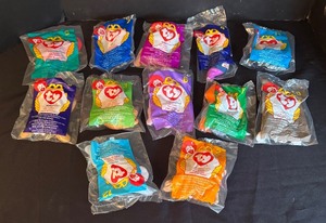 lot 247 image: Set of 12 Vintage McDonalds Ty Beanie Baby Toys Sealed including Pincher, Mel, Bones, Doby, and More