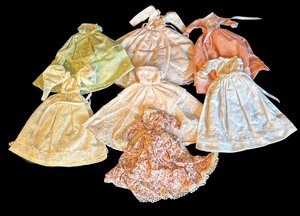 lot 254 image: Vintage Barbie Sized Doll Dresses with Lace Details