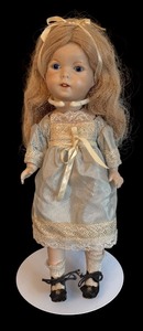 lot 395 image: Vintage Porcelain Doll with Blue Eyes