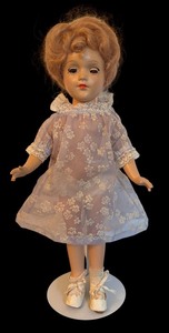 lot 397 image: Vintage Marlene Dietrich Doll with Floral Dress