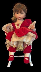 lot 449 image: Marie Osmond Limited Edition Porcelain Doll with Red Dress and Rocking Chair