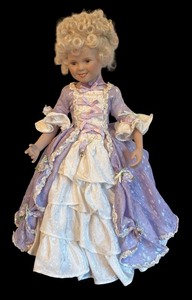 lot 575 image: Shirley Temple Porcelain Doll in Victorian Lavender Dress