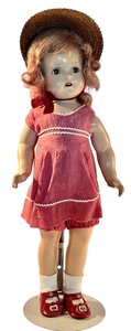 lot 136 image: Vintage 20-Inch Alexander Doll 1937-1941 with Red Dress and Straw Hat