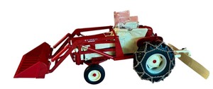 lot 326 image: McCormick Farmall Tractor Diecast Model with Loader and Blade in Very Good Condition
