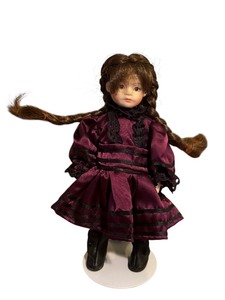 lot 376 image: Artisan Porcelain Doll by Chris Miler in Plum Dress,