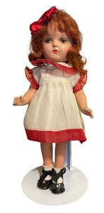 lot 388 image: Vintage 13-Inch Composition Doll with Red Hair and Dress