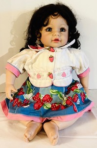 lot 622C image: DR - Adora Inc. Porcelain Doll with Black Hair and Strawberry Dress