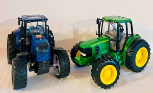 lot 734C image: LR - Pair of Toy Tractors - Blue and Green Plastic Farm Vehicles